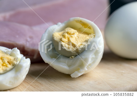 Boiled chicken egg with sliced pieces of meat Boiled chicken egg with sliced pieces of meat 105835882