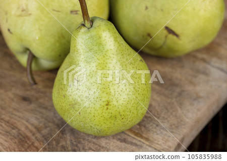green pear on the table while cooking food green pear on the table while cooking food 105835988