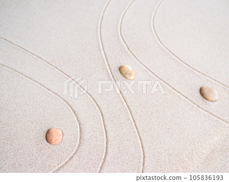 Zen Garden japanese with White Pebble and Texture Line on Sand Background,Top View Rock on Sand Symbols Meditation Still Religion Janpan,Nature Balance Circle Rock for Spa and Calm Buddhism Concept. Zen Garden japanese with White Pebble and Texture Line on Sand Background,Top View Rock on Sand Symbols Meditation Still Religion Janpan,Nature Balance Circle Rock for Spa and Calm Buddhism Concept. 105836193