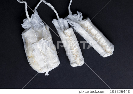 Sewn cotton wool for use as tampons 105836448
