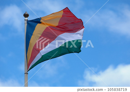 Flag of the Seychelles waving atop of its pole 105838719