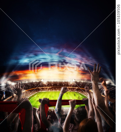 Football scene at night match with with cheering fans at the stadium Football scene at night match with with cheering fans at the stadium 105839506
