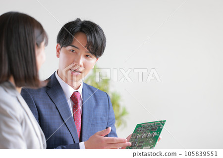 Engineer male explaining the board _1 105839551