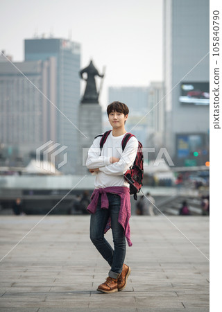 A young man traveling in Seoul, South Korea, with a backpack 105840790