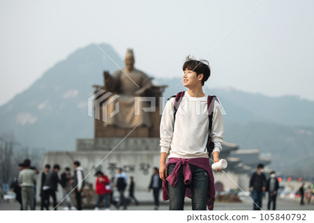 A young man traveling in Seoul, South Korea, with a backpack 105840792