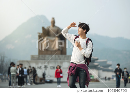 A young man traveling in Seoul, South Korea, with a backpack 105840793