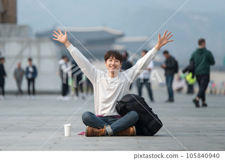 A young man traveling in Seoul, South Korea, with a backpack 105840940