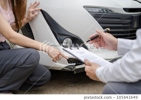 Insurance concept, insurance agent checking broken car and submit a claim form after an accident traffic accident 105841649