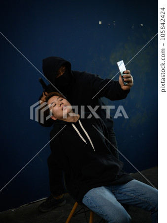 Masked criminal with guns and woman hostage reports the ransom selfie the video call 105842424