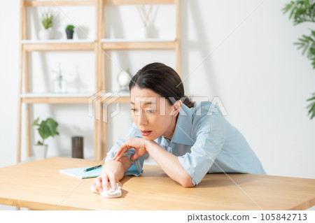 Living room woman malaise tired Living room woman malaise tired 105842713