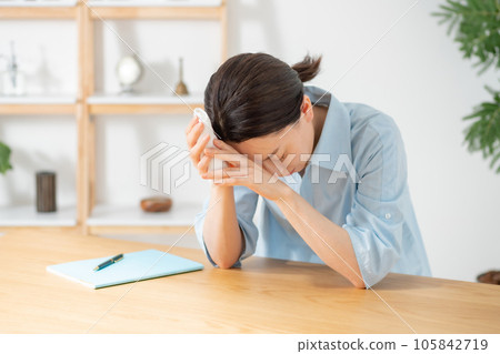 Living room woman malaise tired 105842719