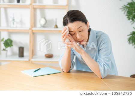 Living room woman malaise tired 105842720