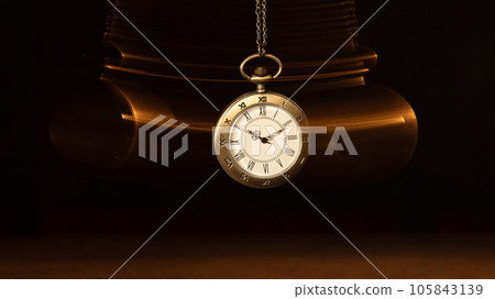 Hypnosis session. Vintage pocket watch with chain swinging over surface on dark background among faded clock faces, magic motion effect Hypnosis session. Vintage pocket watch with chain swinging over surface on dark background among faded clock faces, magic motion effect 105843139