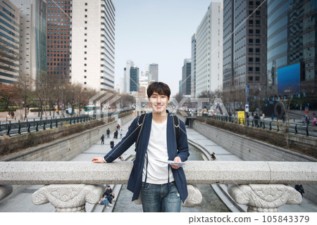 A young man traveling in Seoul, South Korea, with a backpack 105843379