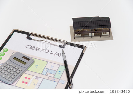 Image of housing consultation with floor plan and calculator Image of housing consultation with floor plan and calculator 105843430