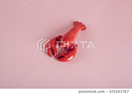 a red lobster on a pink background 105843767
