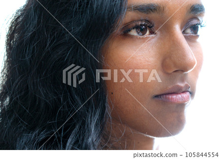 Half frontal portrait closeup of a young woman Half frontal portrait closeup of a young woman 105844554
