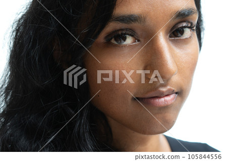 A closeup portrait of a young woman half smiling A closeup portrait of a young woman half smiling 105844556