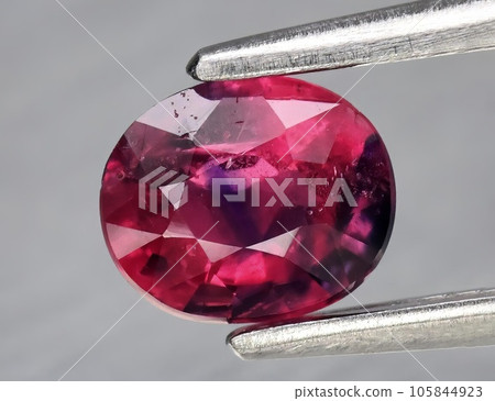 Natural gemstone pink sapphire isolated on white background Natural gemstone pink sapphire isolated on white background 105844923