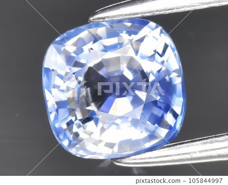 Natural gemstone blue sapphire on gray background 105844997