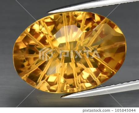 Natural gemstone yellow citrine on gray background Natural gemstone yellow citrine on gray background 105845044