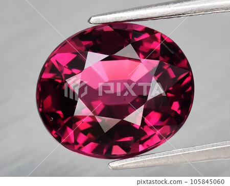 Natural gemstone pink rhodolite garnet on white background Natural gemstone pink rhodolite garnet on white background 105845060