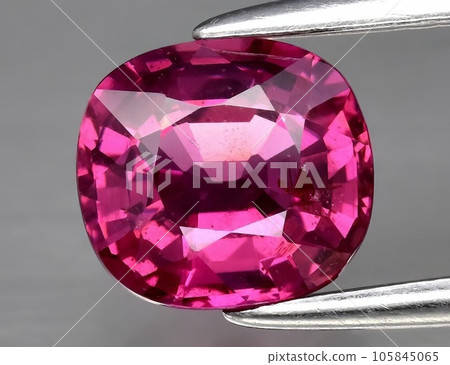 Natural gemstone pink rhodolite garnet on white background Natural gemstone pink rhodolite garnet on white background 105845065