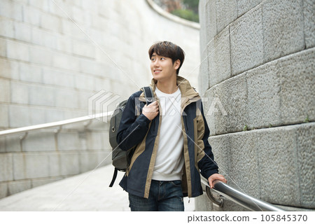 Young male college student traveling with a backpack in Korea 105845370