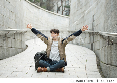 Young male college student traveling with a backpack in Korea 105845437