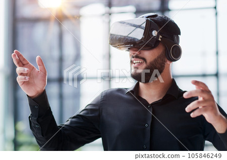Businessman in virtual reality glasses or headset 105846249