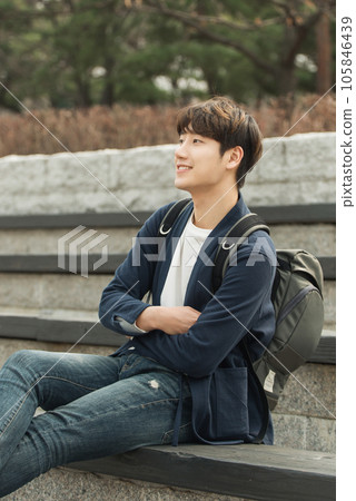 young man sitting on the stairs 105846439