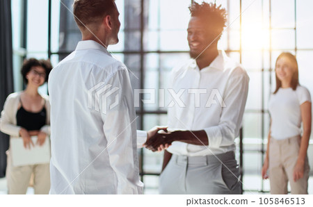 Congratulating the new partners in modern office 105846513