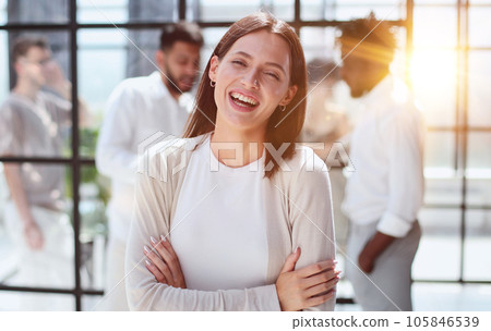 business woman with her staff in background at office business woman with her staff in background at office 105846539