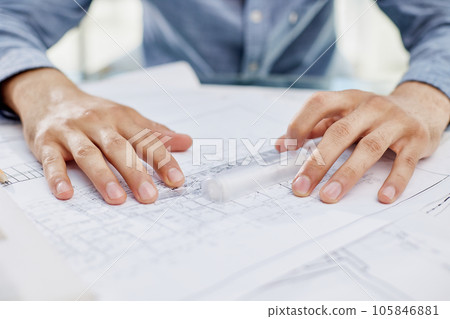 Young handsome architect engineer working on design plan Young handsome architect engineer working on design plan 105846881
