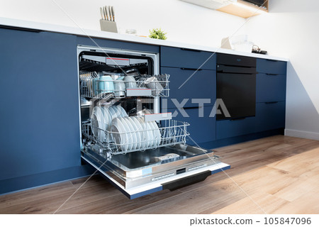 Dishwasher in modern kitchen. Washing dishes Dishwasher in modern kitchen. Washing dishes 105847096