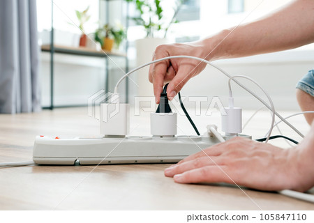 Electrical plug in outlet socket at home Electrical plug in outlet socket at home 105847110