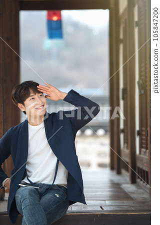 a young man resting in a traditional Korean house a young man resting in a traditional Korean house 105847200