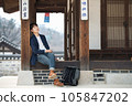a young man resting in a traditional Korean house 105847202