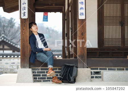 a young man resting in a traditional Korean house 105847202