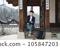 a young man resting in a traditional Korean house 105847203