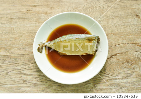 boiled salty and sweet mackerel fish sauce soup on plate boiled salty and sweet mackerel fish sauce soup on plate 105847639