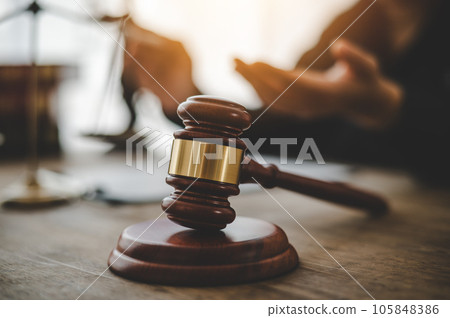 Law theme, mallet of the judge, law enforcement officers, evidence-based cases and documents taken into account.. 105848386