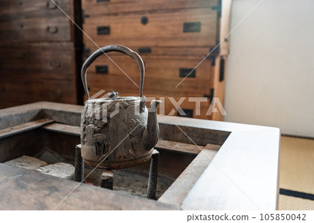 Iron bottle in the hearth Iron bottle in the hearth 105850042