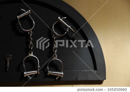 Police Handcuffs Hanging on the wall Police Handcuffs Hanging on the wall 105850060