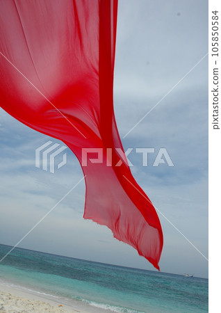 Red Color Cloth Flying In Wind 105850584