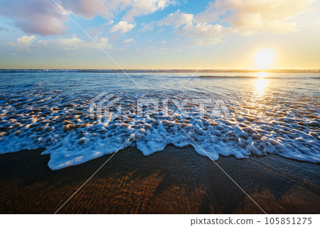 Atlantic ocean sunset with surging waves at Fonte da Telha beach, Costa da Caparica, Portugal 105851275