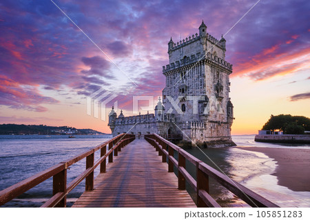 Belem Tower or Tower of St Vincent - famous tourist landmark of Lisboa and tourism attraction - on the bank of the Tagus River (Tejo) in evening dusk after sunset with dramatic sky. Lisbon, Portugal 105851283