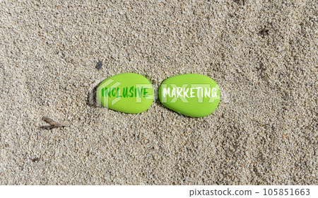 Inclusive marketing symbol. Concept words Inclusive marketing on beautiful green stone. Beautiful sand beach background. Business inclusive marketing concept. Copy space. Inclusive marketing symbol. Concept words Inclusive marketing on beautiful green stone. Beautiful sand beach background. Business inclusive marketing concept. Copy space. 105851663