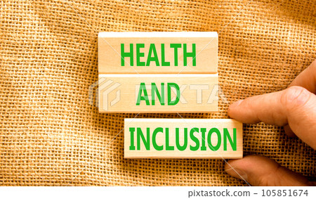 Health and inclusion symbol. Concept words Health and inclusion on wooden block. Beautiful canvas table canvas background. Doctor hand. Business motivational health and inclusion concept. Copy space. Health and inclusion symbol. Concept words Health and inclusion on wooden block. Beautiful canvas table canvas background. Doctor hand. Business motivational health and inclusion concept. Copy space. 105851674