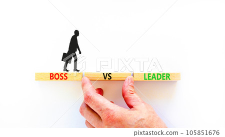 Boss vs leader symbol. Concept words Boss vs versus leader on wooden block. Beautiful white table white background. Businessman hand. Business motivational boss vs leader concept. Copy space. Boss vs leader symbol. Concept words Boss vs versus leader on wooden block. Beautiful white table white background. Businessman hand. Business motivational boss vs leader concept. Copy space. 105851676